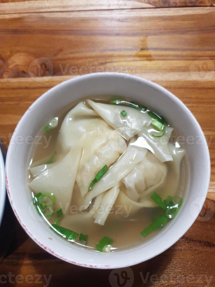 wonton soup that looks very fresh and tempting to eat. photo