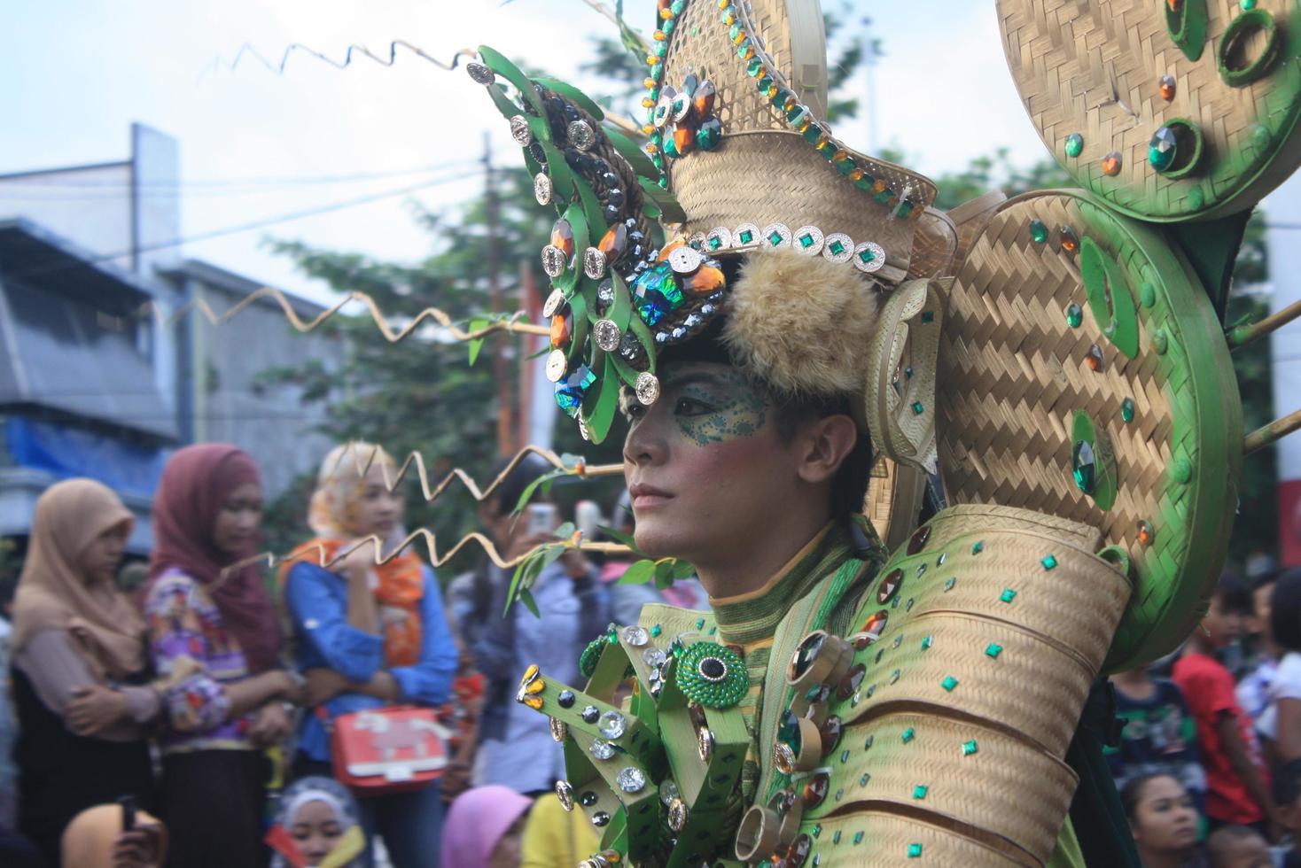 JEMBER, JAWA TIMUR, INDONESIA - AUGUST 25, 2015  jember fashion carnival participants are giving their best performance with their costumes and expressions during the event, selective focus. photo
