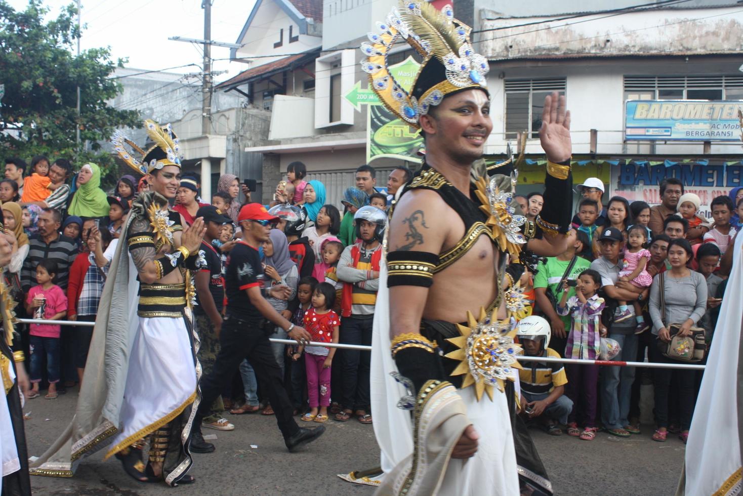 JEMBER, JAWA TIMUR, INDONESIA - AUGUST 25, 2015  jember fashion carnival participants are giving their best performance with their costumes and expressions during the event, selective focus. photo