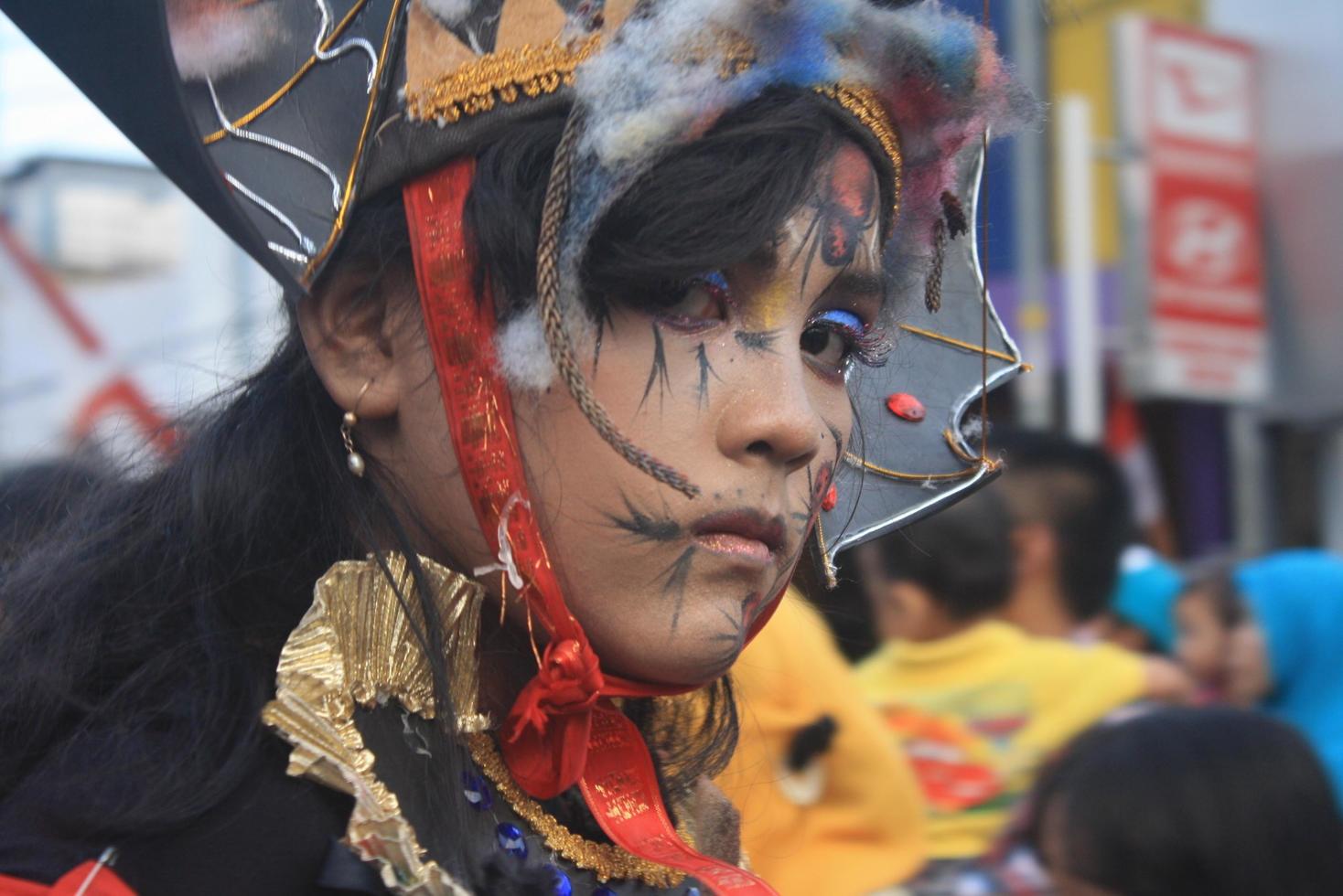 JEMBER, JAWA TIMUR, INDONESIA - AUGUST 25, 2015  jember fashion carnival participants are giving their best performance with their costumes and expressions during the event, selective focus. photo