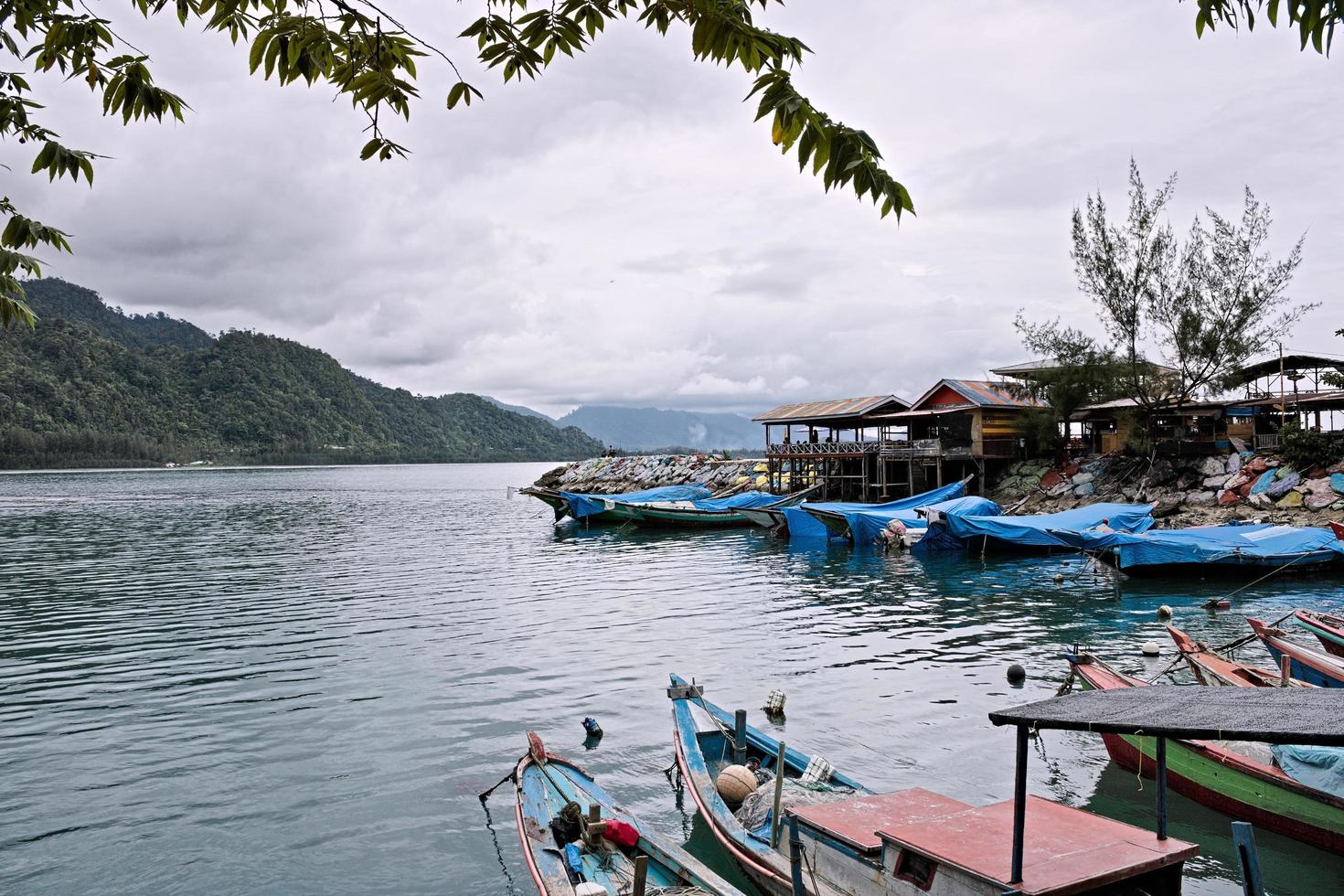 Fishing Boats rest at their moorings in the shelter. south of aceh, indonesia. photo