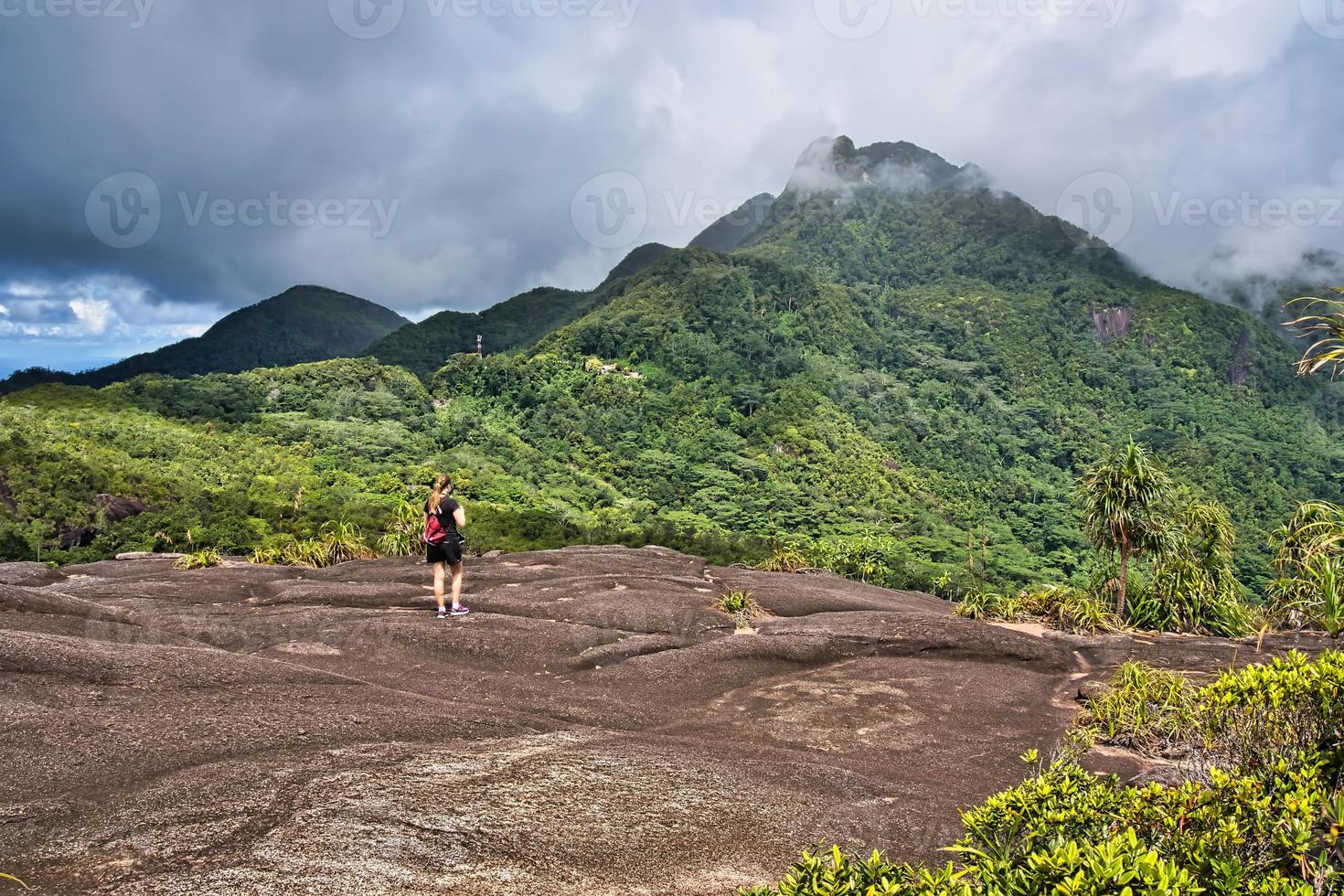 Copolia trail young woman wating Seychelles highest mountain, morn Seychellois Mahe Seychelles 2 photo