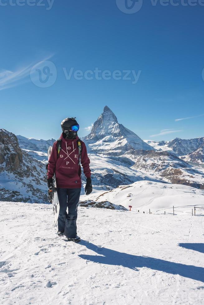 Young snowboarder spending winter holidays in Zermatt, near the famous