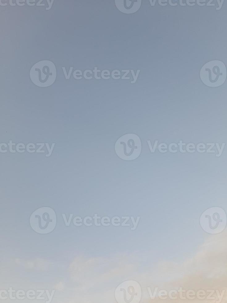 Beautiful white clouds on deep blue sky background. Large bright soft fluffy clouds are cover the entire blue sky. photo