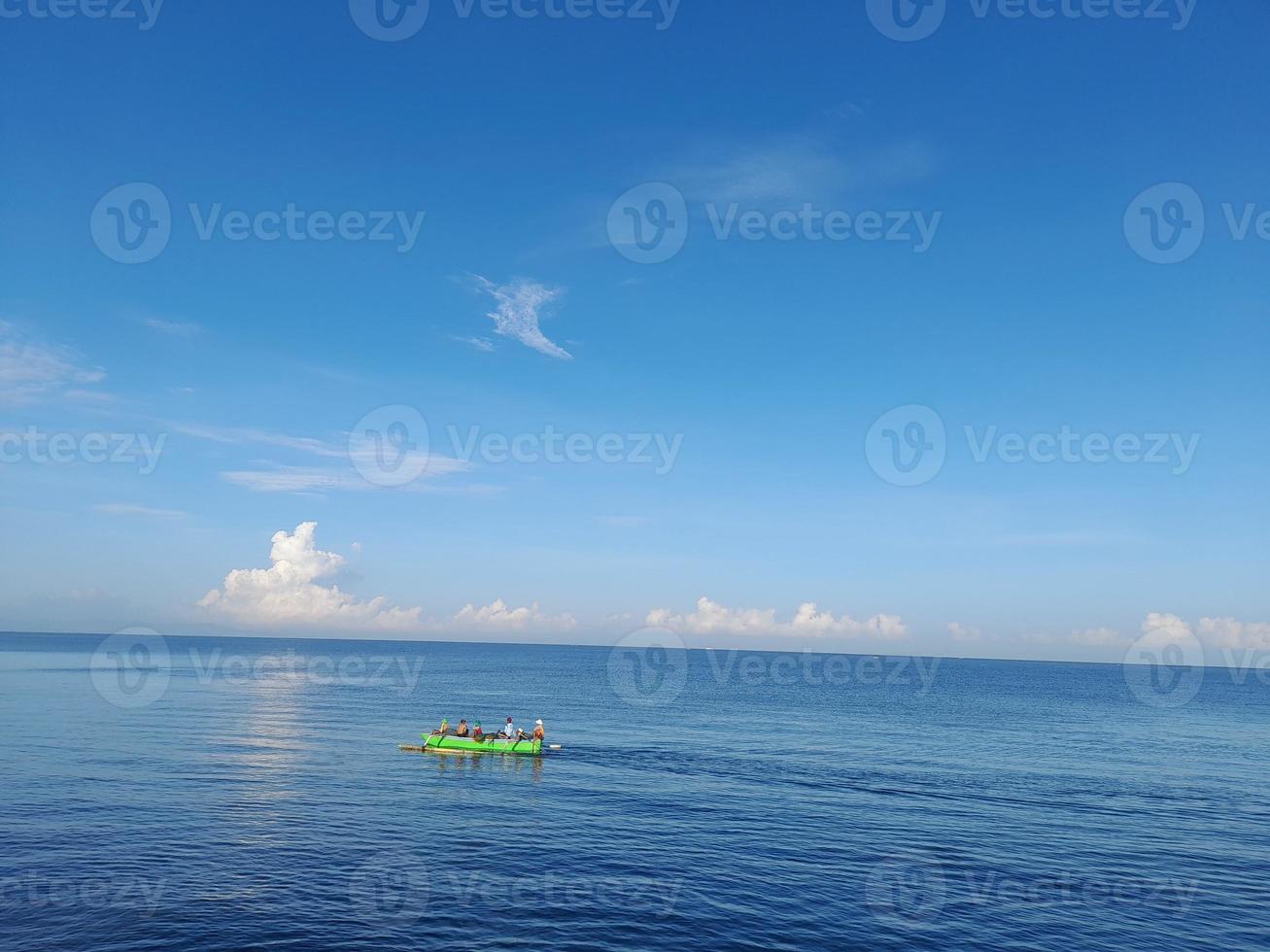 fishermen who are looking for fish around the coast photo