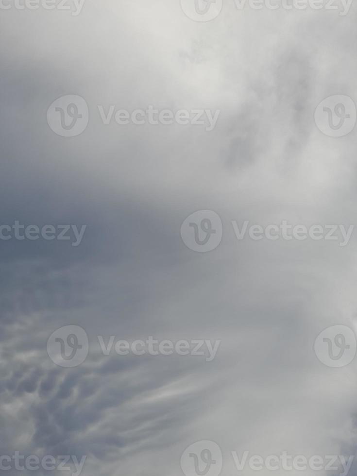 Beautiful clouds on deep blue sky background. Large bright soft fluffy clouds are cover the entire blue sky. photo