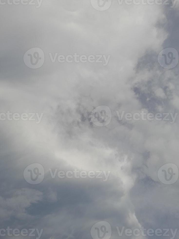 Beautiful clouds on deep blue sky background. Large bright soft fluffy clouds are cover the entire blue sky. photo