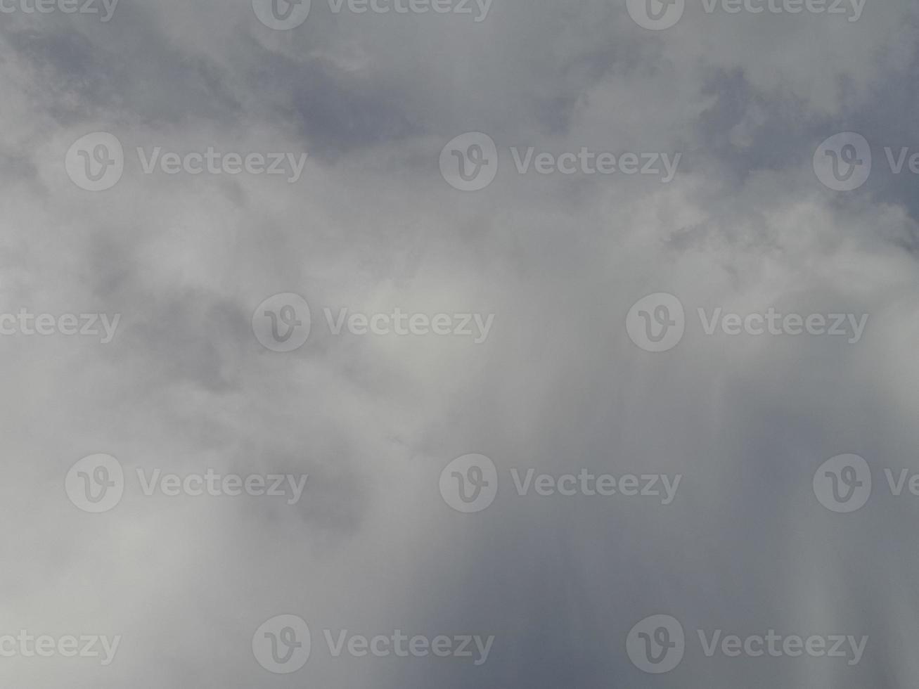 Beautiful clouds on deep blue sky background. Large bright soft fluffy clouds are cover the entire blue sky. photo