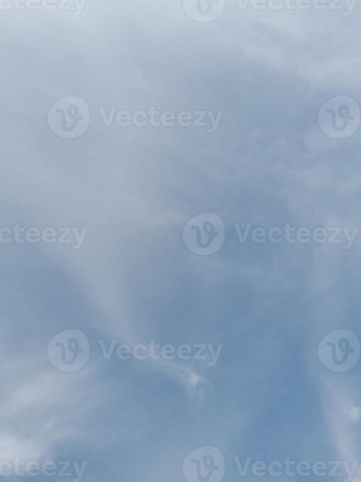 Beautiful white clouds on deep blue sky background. Large bright soft fluffy clouds are cover the entire blue sky. photo