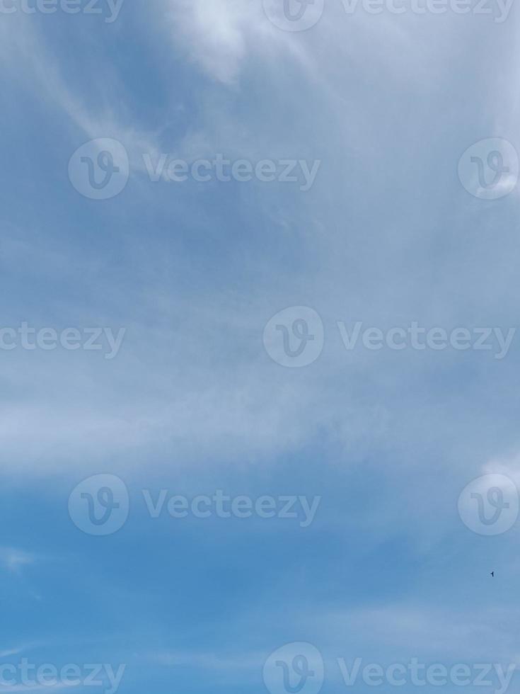 Beautiful white clouds on deep blue sky background. Large bright soft fluffy clouds are cover the entire blue sky. photo