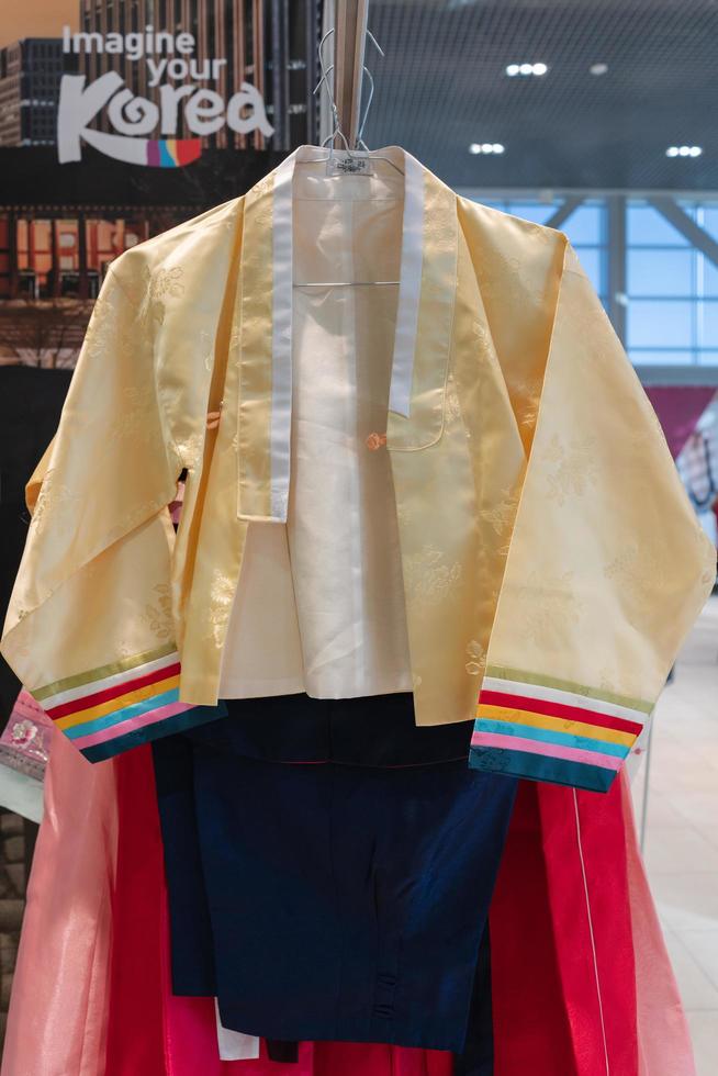 Kamchatka, Russia, Oct 17, 2019 - Hanbok - Korean traditional women clothes vibrant color for attire during traditional occasions festivals, celebrations, ceremonies. Dress hanging on clothes hanger. photo