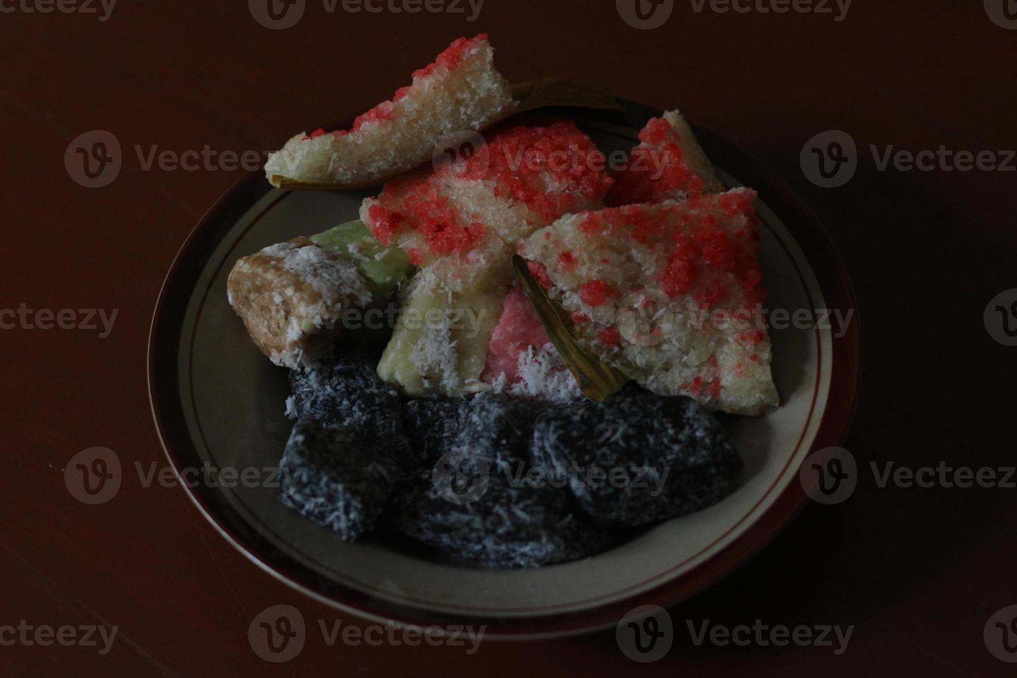 sengkulun, cenil, and getuk served on a plate and ready to eat. photo