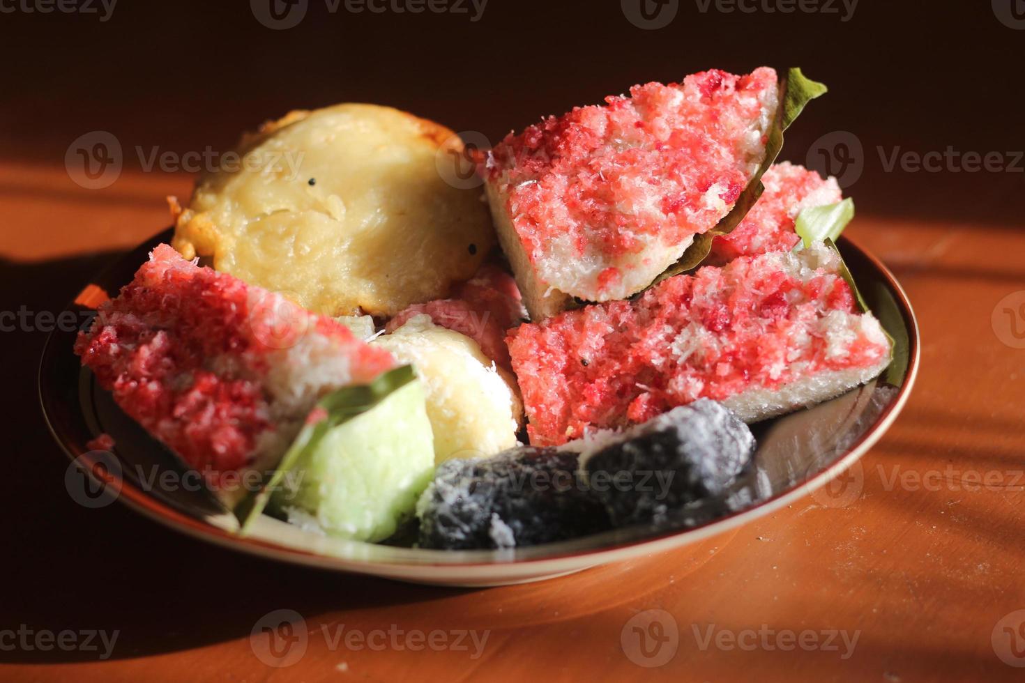 sengkulun, cenil, and getuk served on a plate and ready to eat. photo