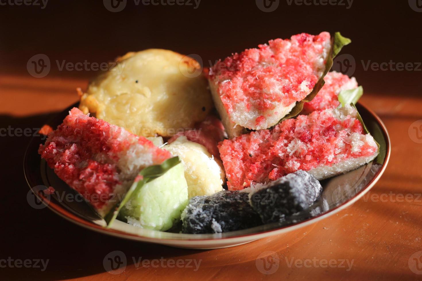 sengkulun, cenil, and getuk served on a plate and ready to eat. photo