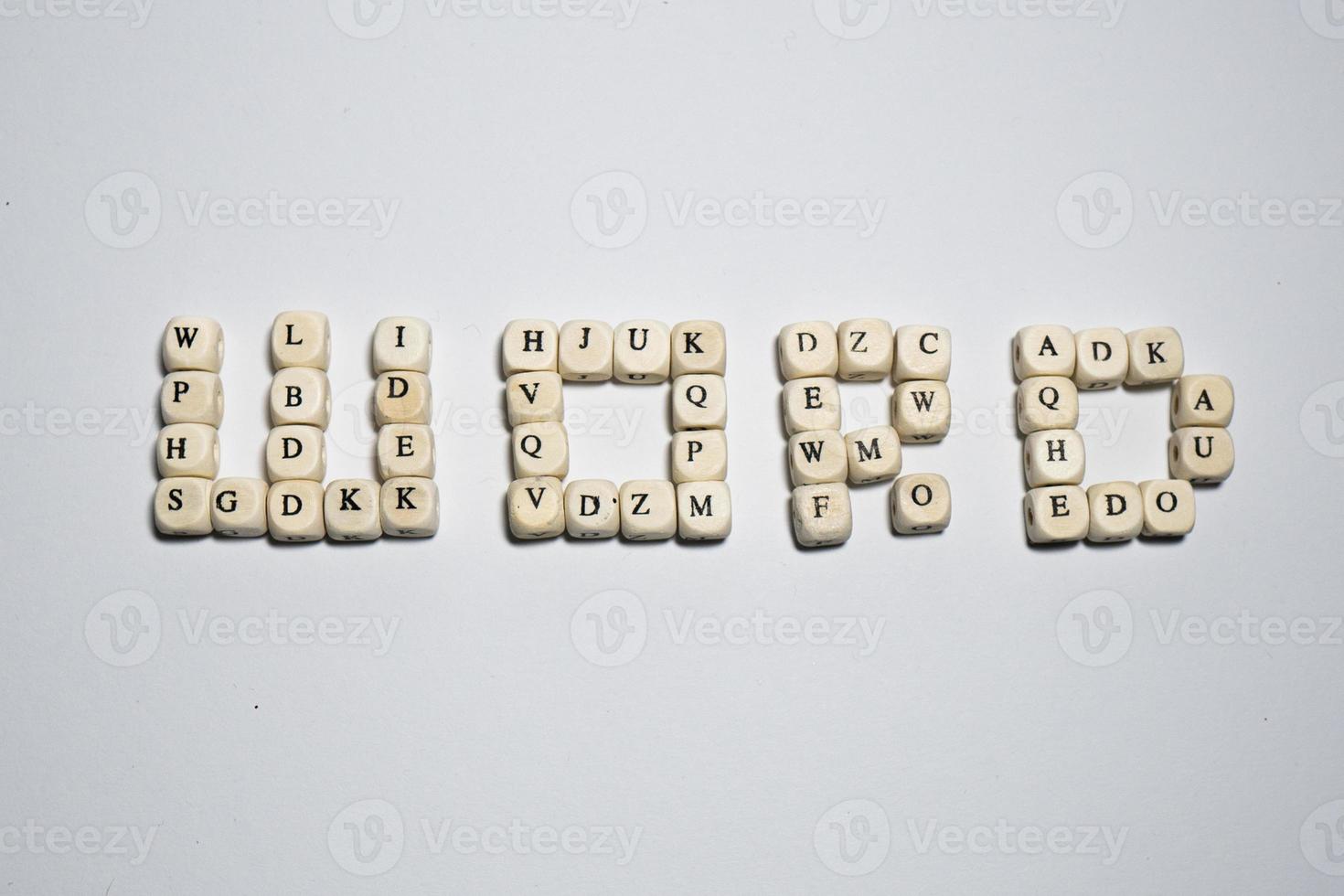 Wood cubes with letters word alphabet text background photo