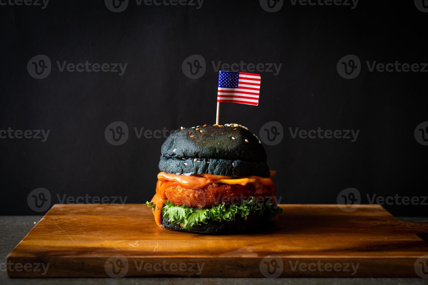 fried shrimps burger on wood tray photo