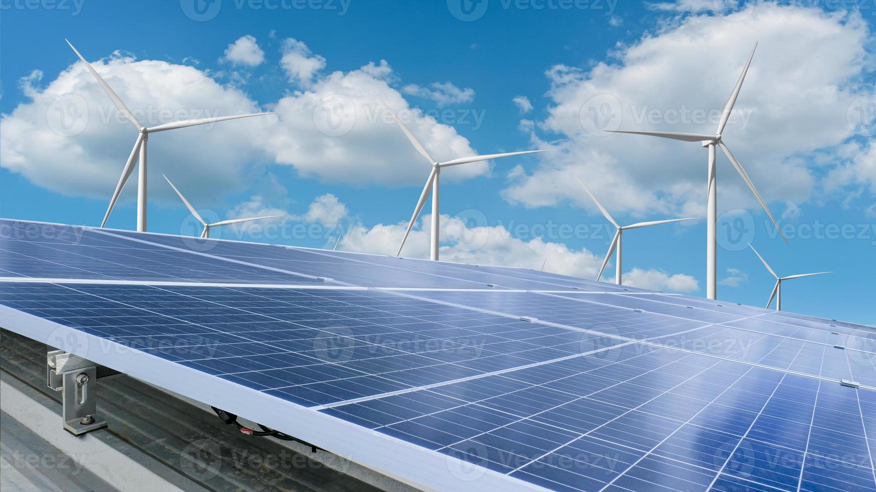 Solar module panels with wind turbine against blue sky background. Environmental energy resources concept. photo