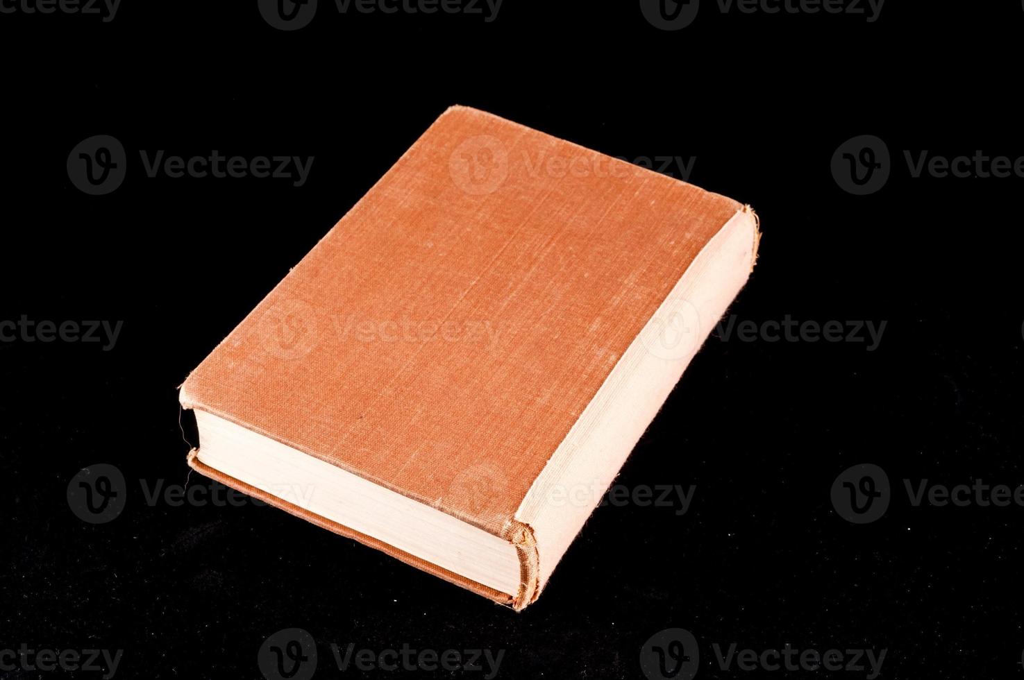 Book isolated on black background photo