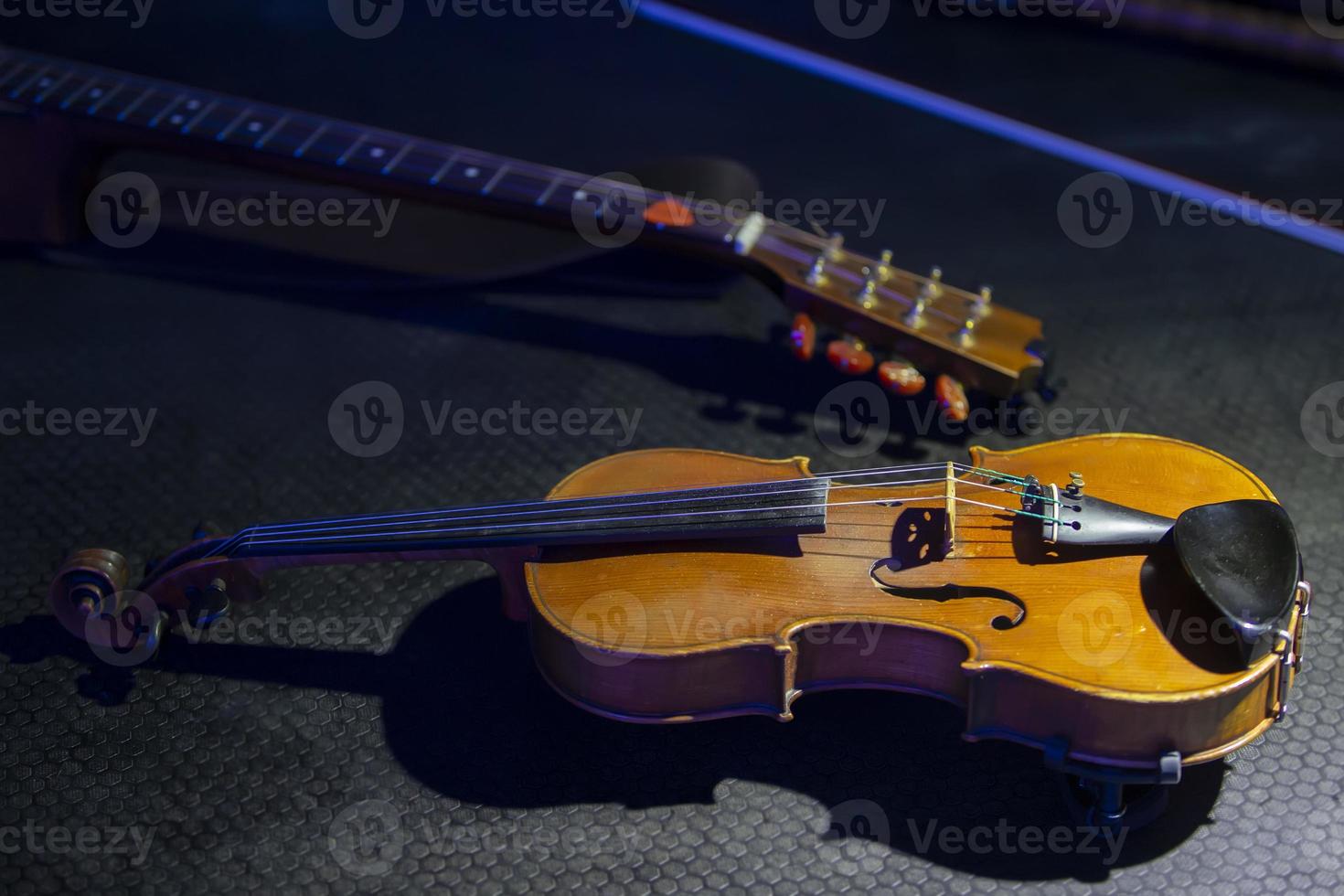 Antique violin on a dark background. Retro musical instrument. photo