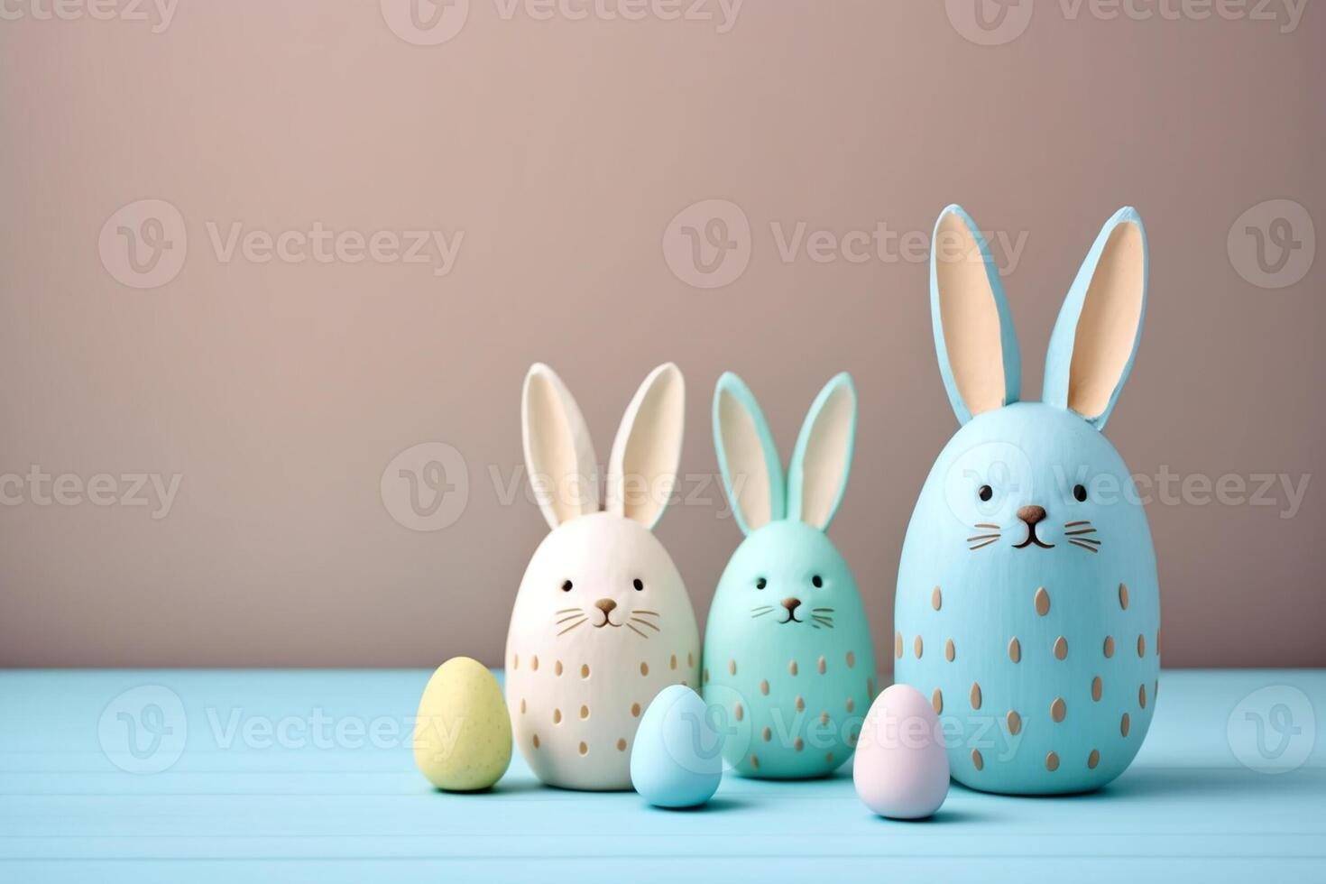 Egg shape bunnies decoration and colored eggs with pink wall behind. . photo