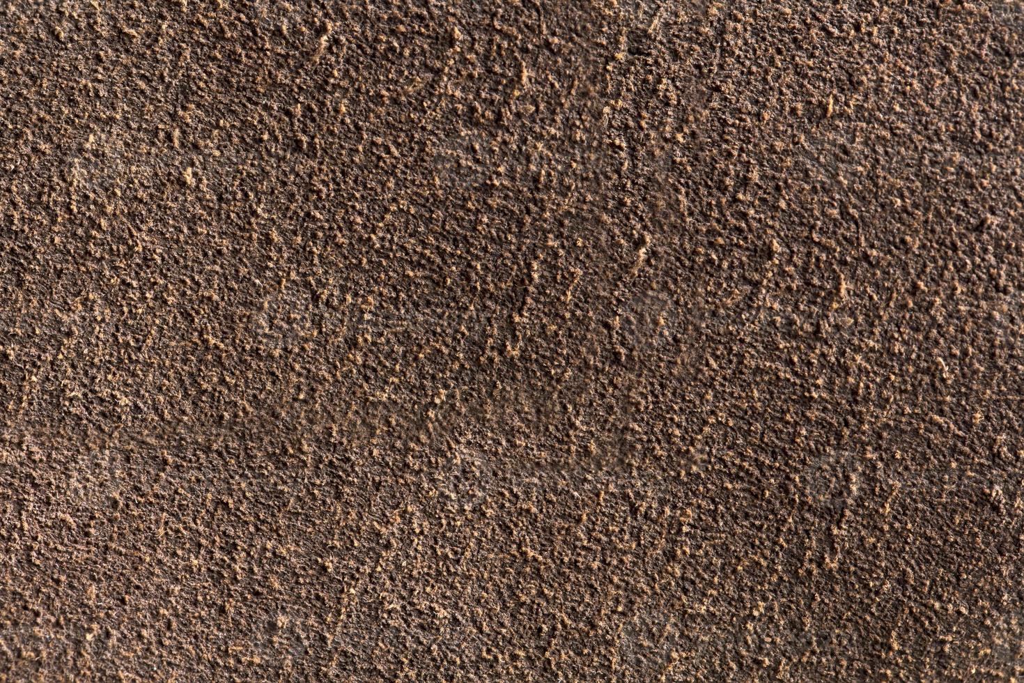 Background macro texture of suede brown leather. photo