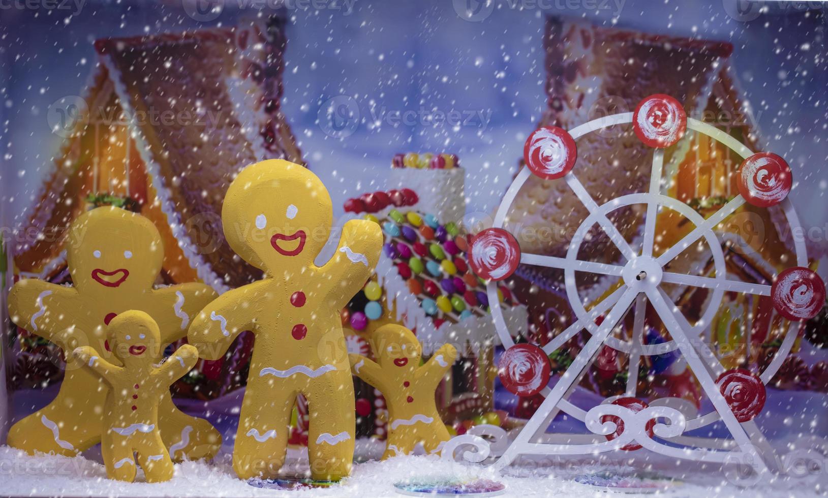 A family of gingerbread men on a Christmas background. Background for greeting card, calendar. photo