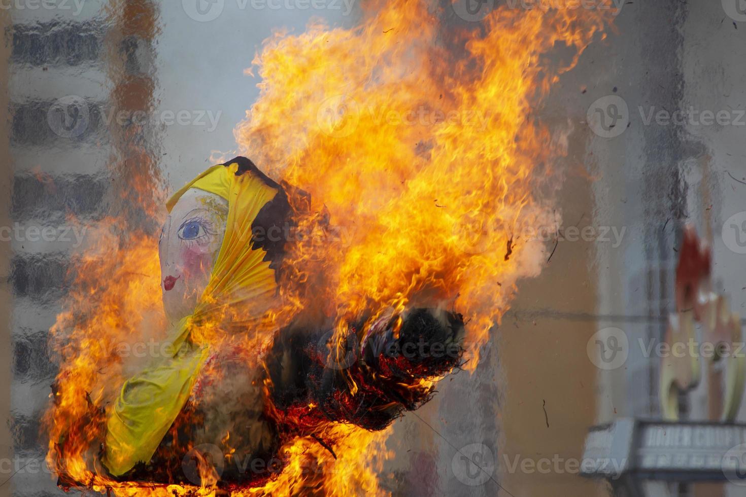 Maslenitsa. Burning scarecrow. Ethnic doll on fire. photo