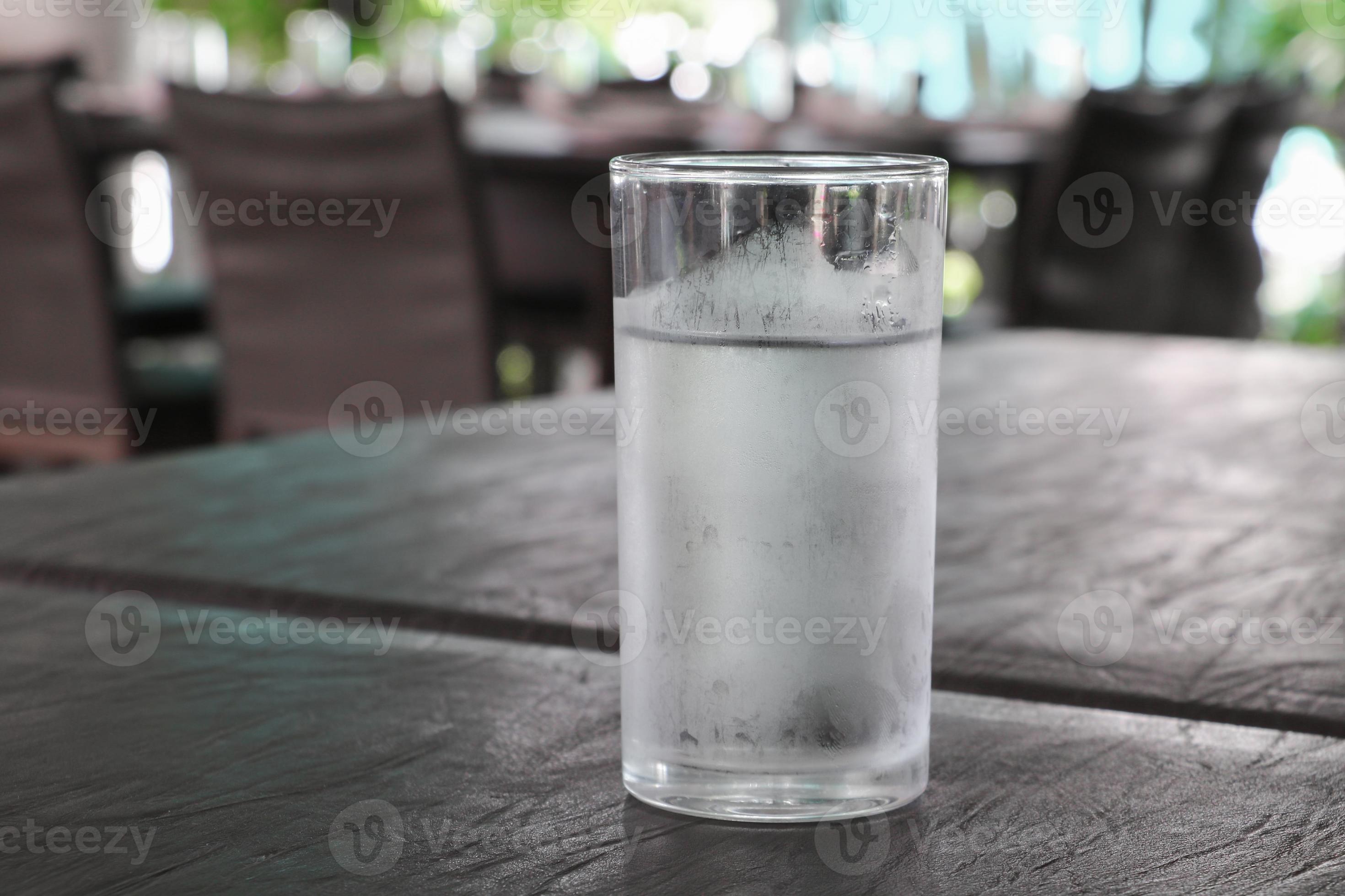 Glass of cold water on table 21963943 Stock Photo at Vecteezy