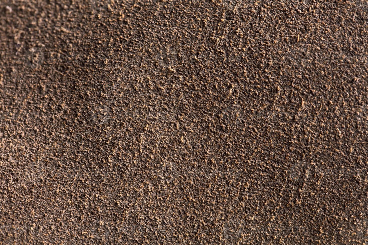 Background macro texture of suede brown leather. photo