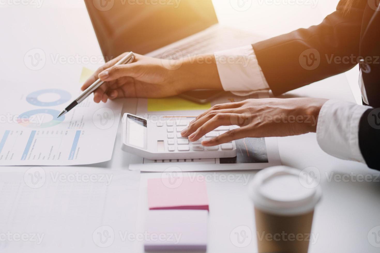 Financial analysts analyze business financial reports on a digital tablet planning investment project during a discussion at a meeting of corporate showing the results of their successful teamwork. photo