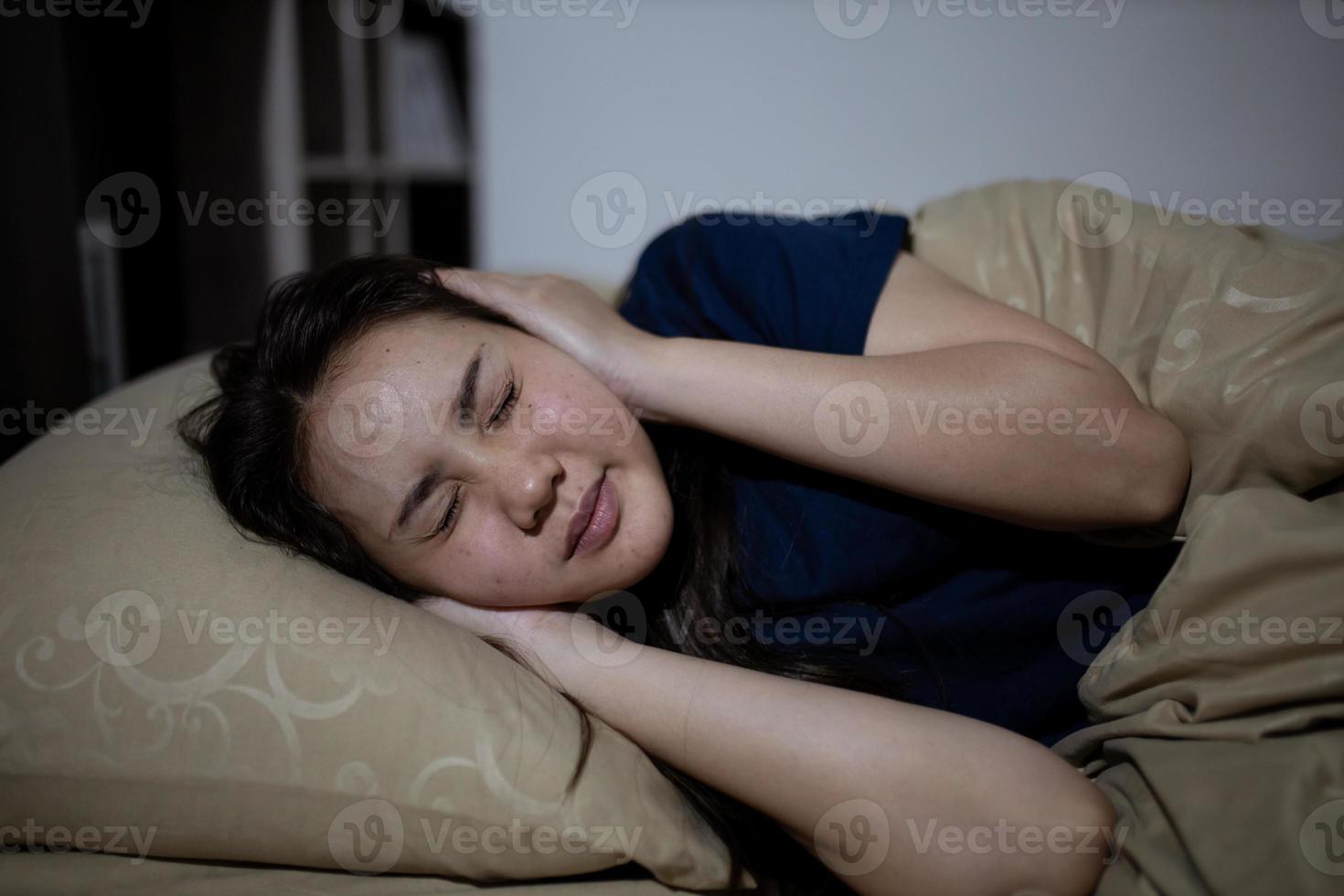 Young asian woman cannot sleep insomnia late at night. Can't sleep. Sleep apnea or stress. Sleep disorder concept. photo