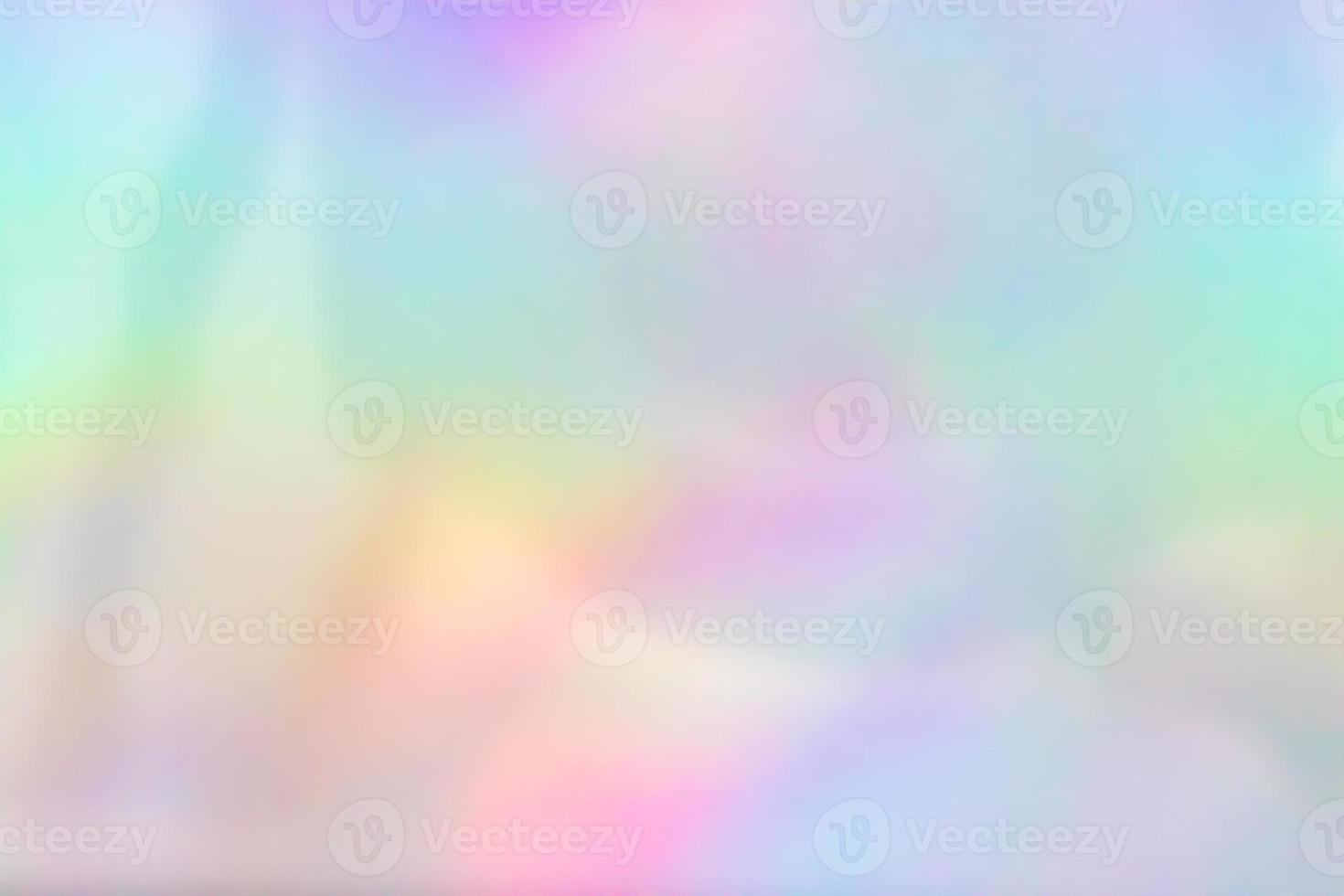 Abstract blur holographic rainbow foil iridescent background photo