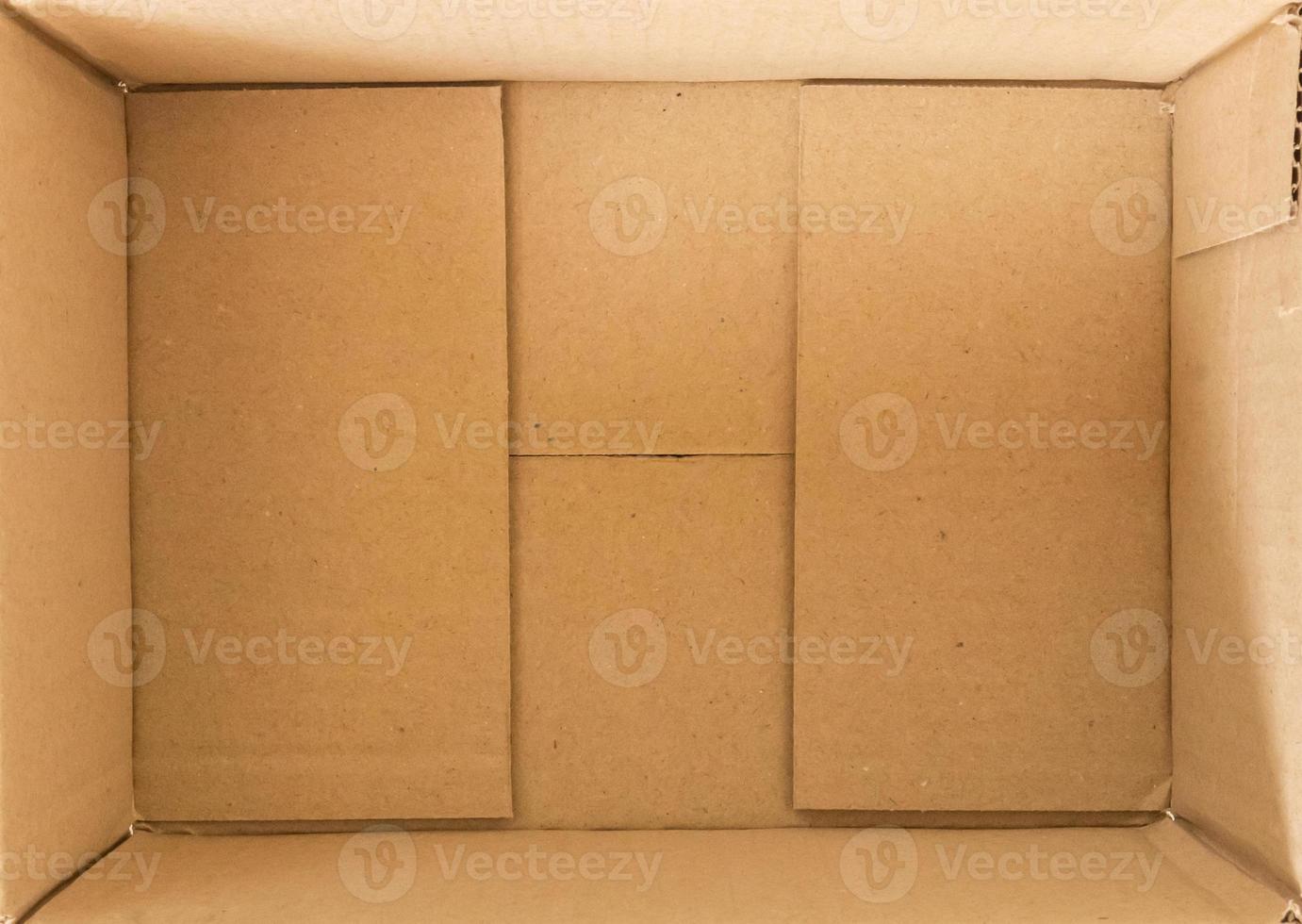 Open empty brown cardboard box background top view photo