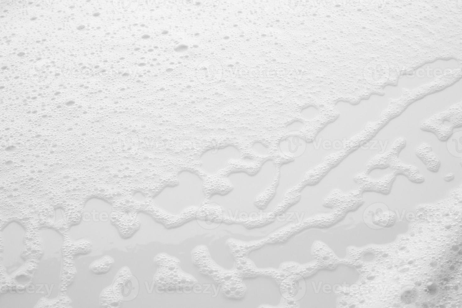 Abstract white soap foam bubbles texture on white background photo