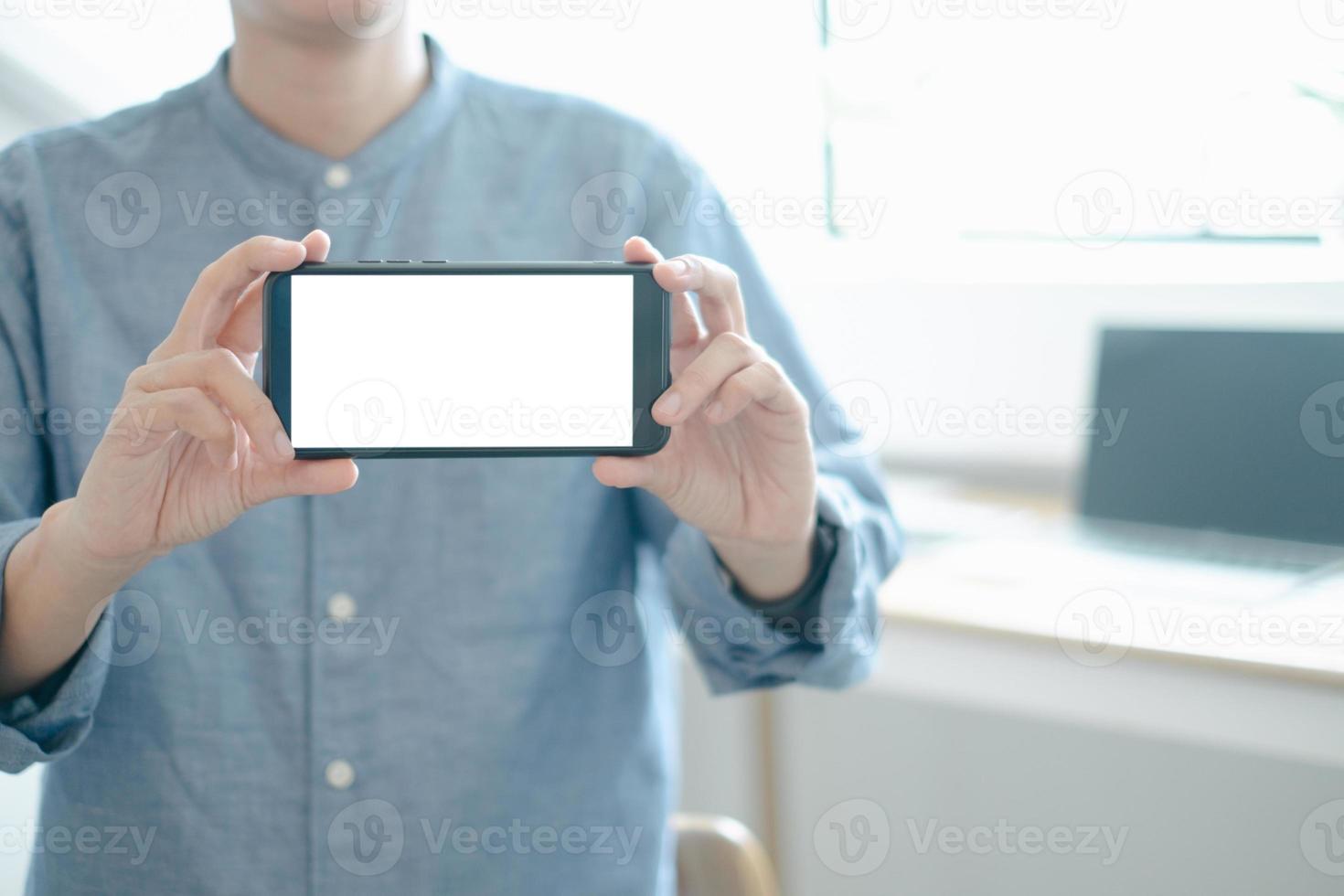 Mockup image of engineers showing smartphone design building Project in office, mockup concept photo
