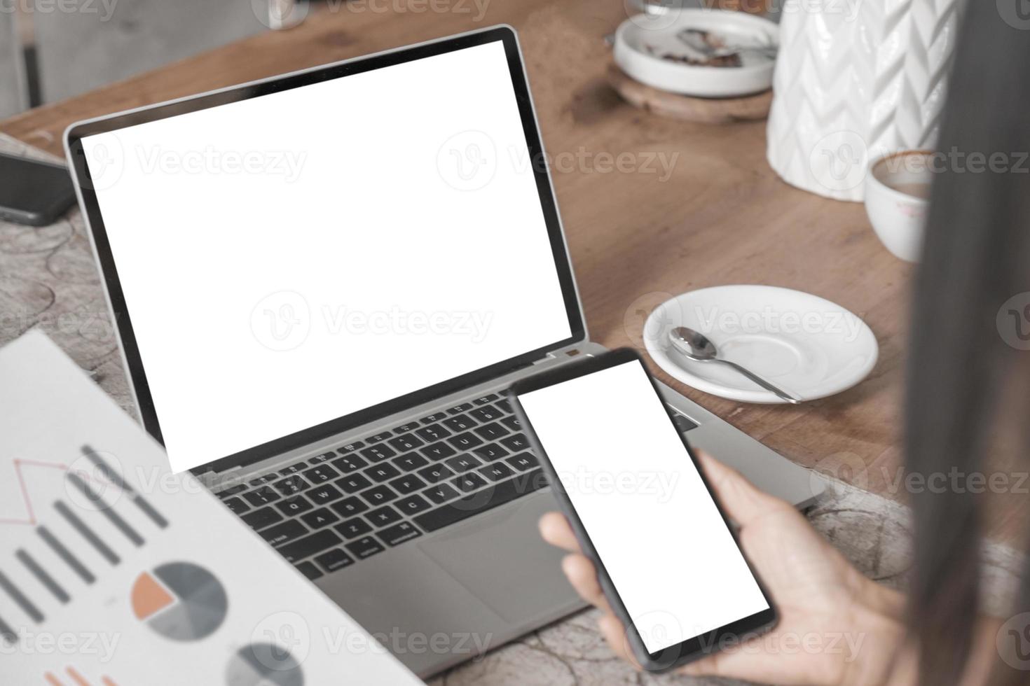 Mockup image of close up business woman working with smartphone laptop and documents in office, mockup concept photo