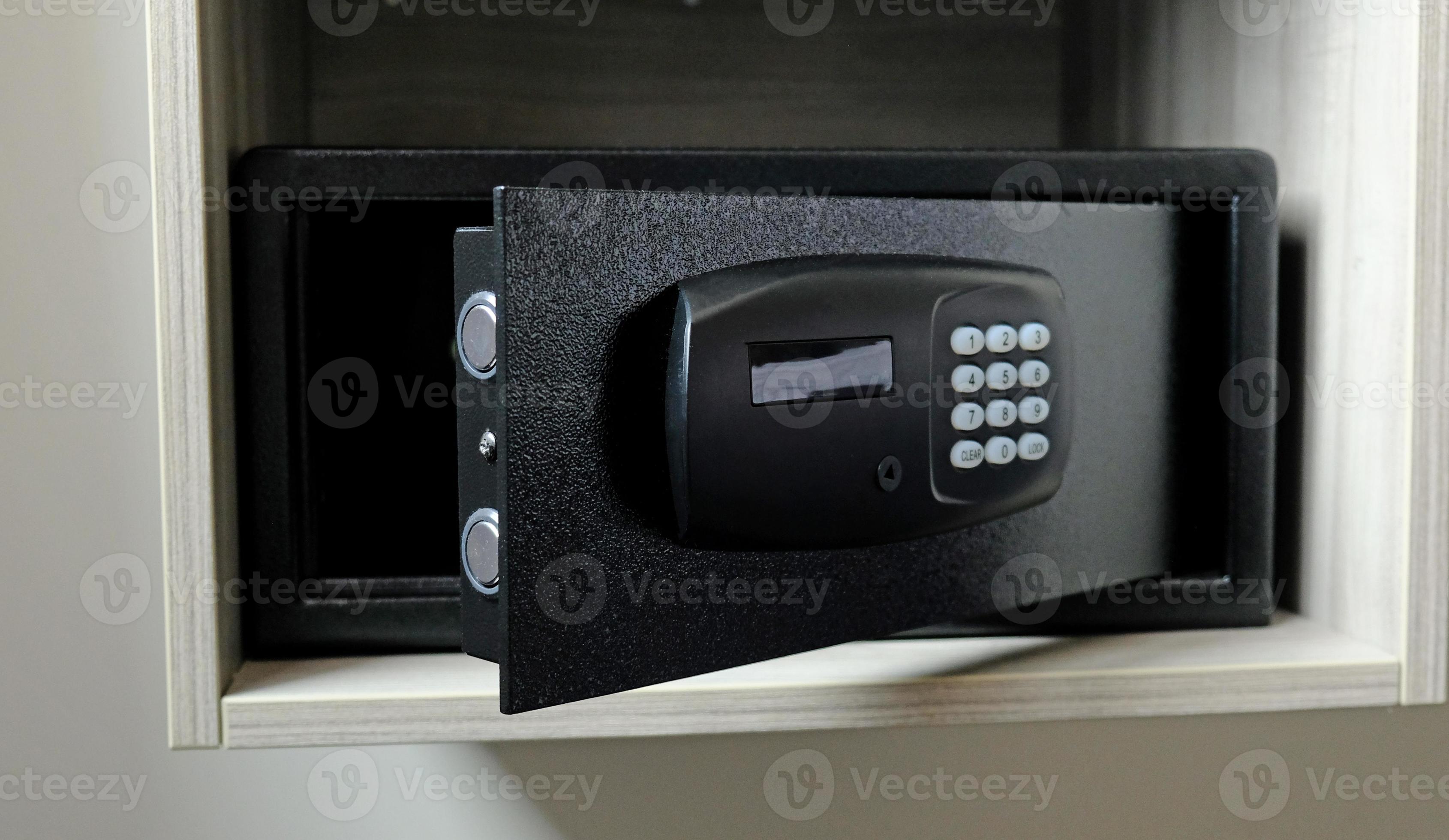 Metal safe box in the closet. Small narrow safe for keeping money or