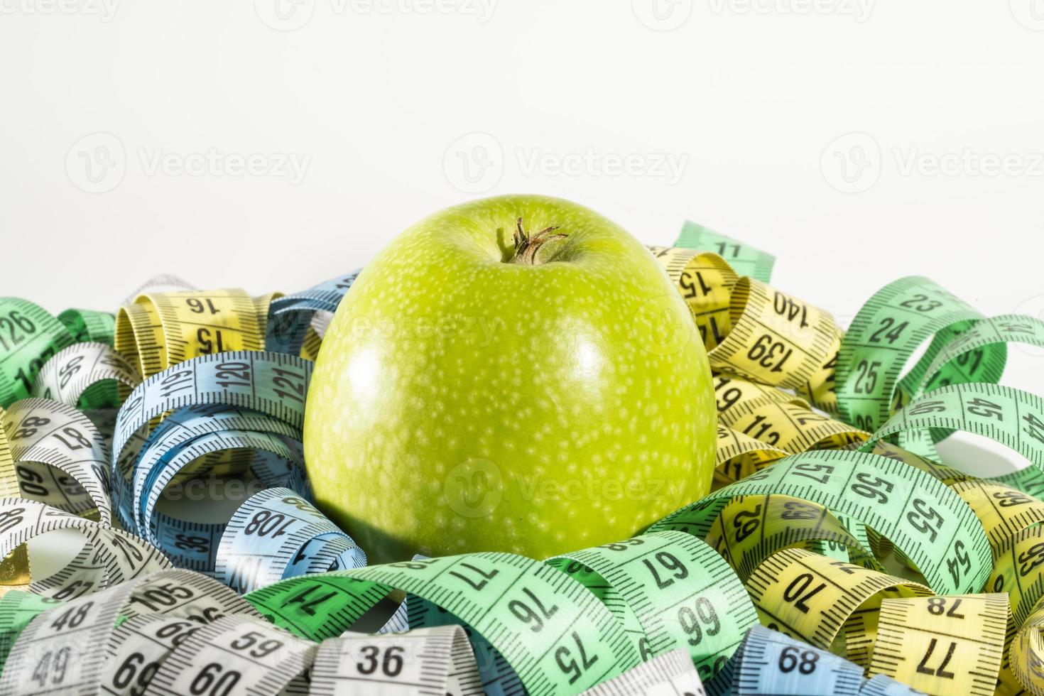 Apple and measuring tape, Diet. photo