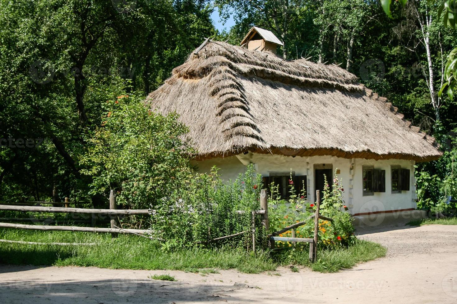 Old rural house in the summer season photo