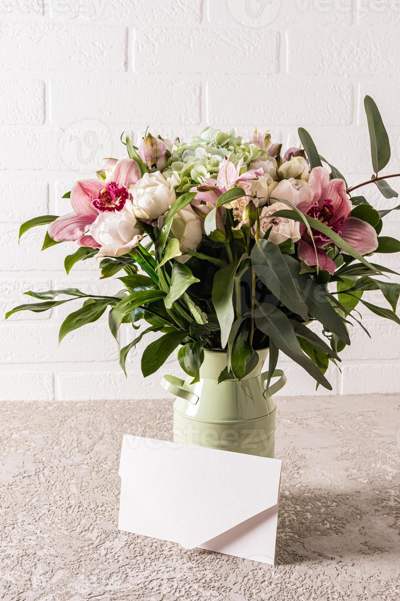 a delicate bouquet of fresh astromeria flowers in a decorative metal