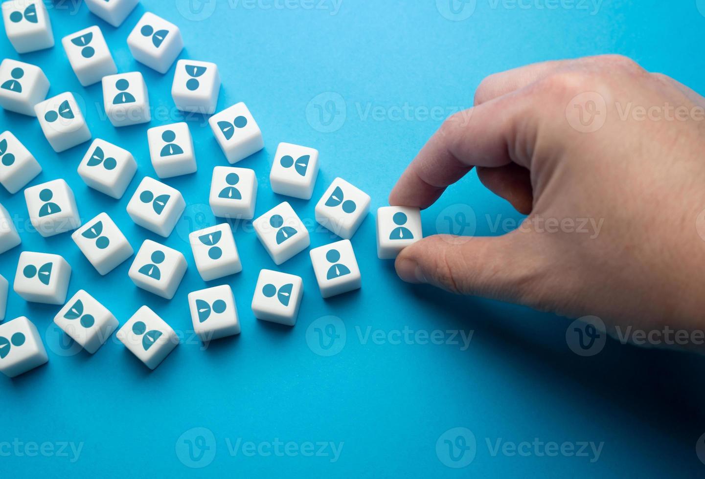 The hand selects the best candidates for hiring. Distinguished students. Build a hierarchical system in the community. Recruitment. Form a new team. Organization of the work of a business company. photo