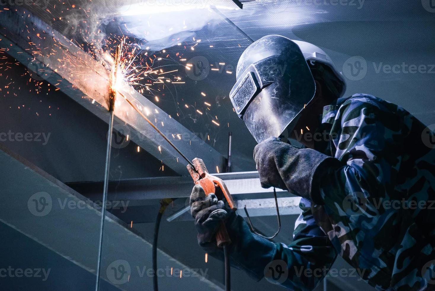 Arc welding of a steel in construction site photo
