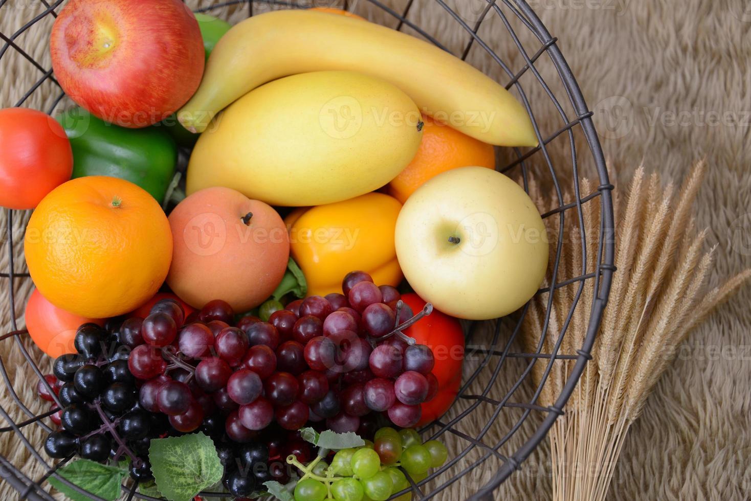 Basket and fresh fruits photo