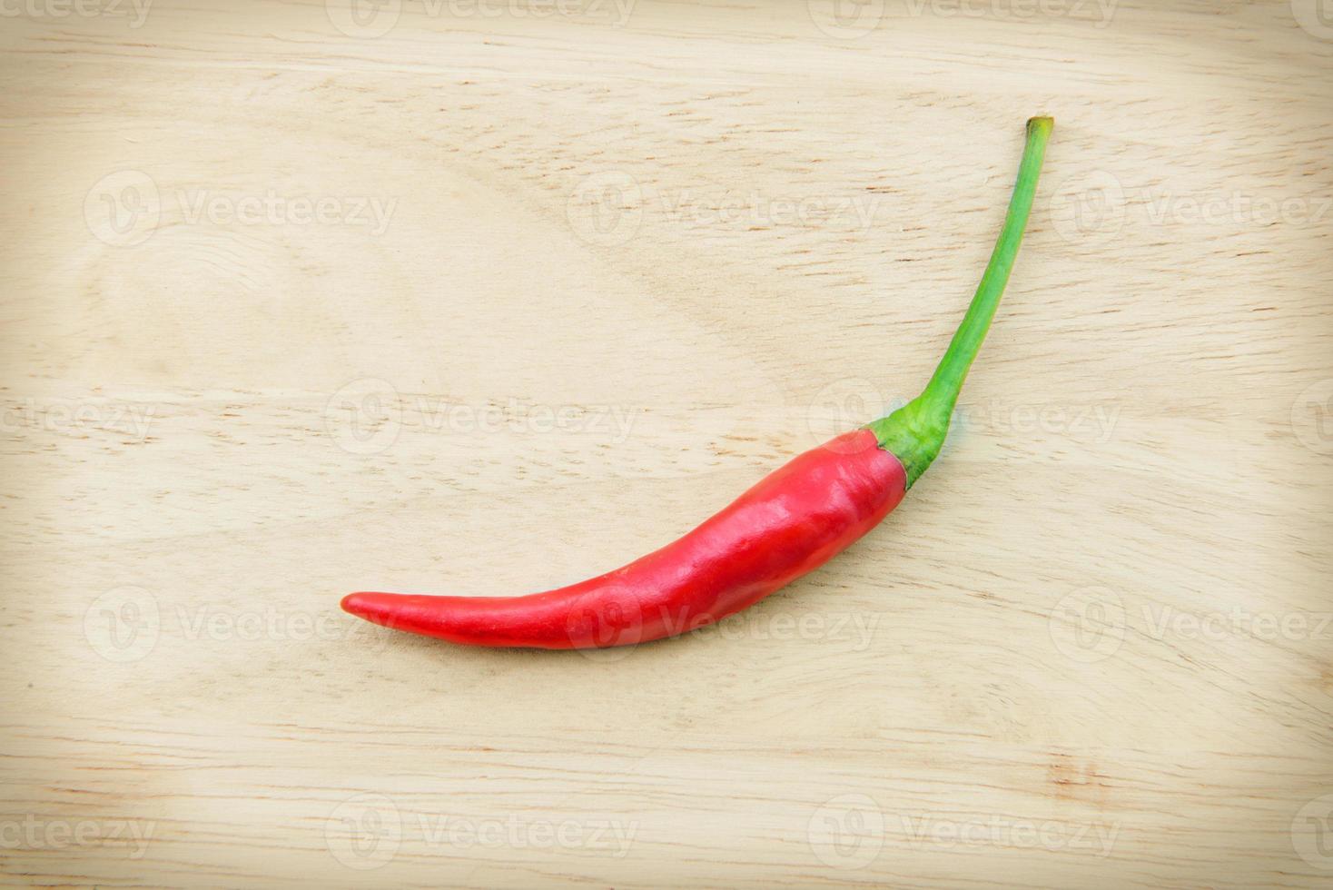 red chilies on wood background photo