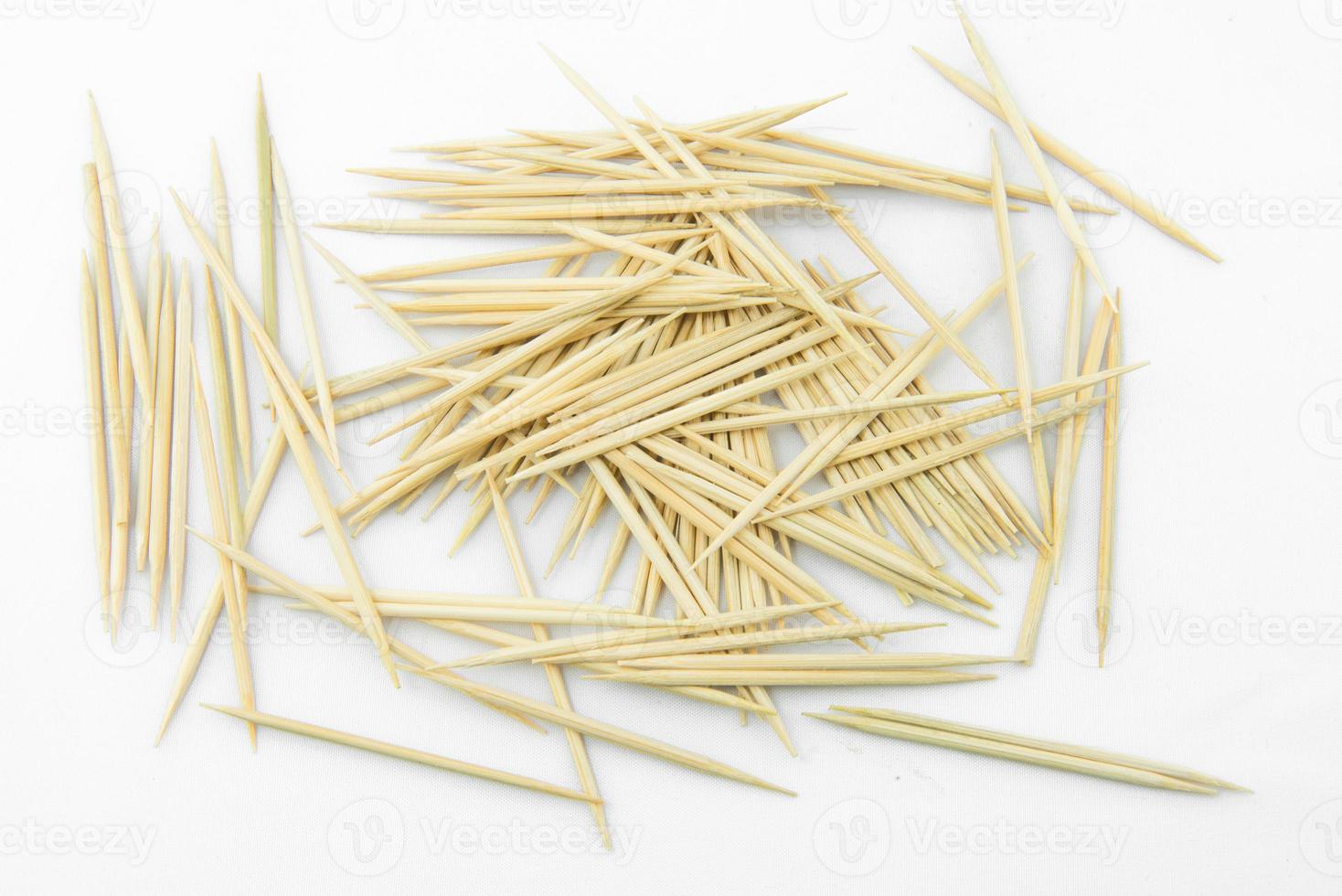 Many toothpicks on a white background photo