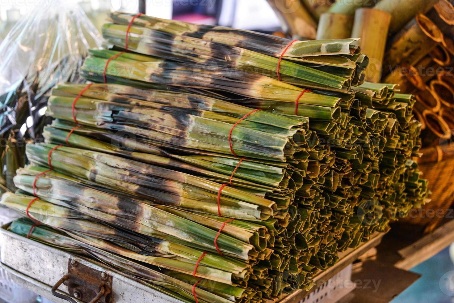 Kanom Jark, Thai sweetmeat made of flour, coconut and sugar with nipa plam leaves photo