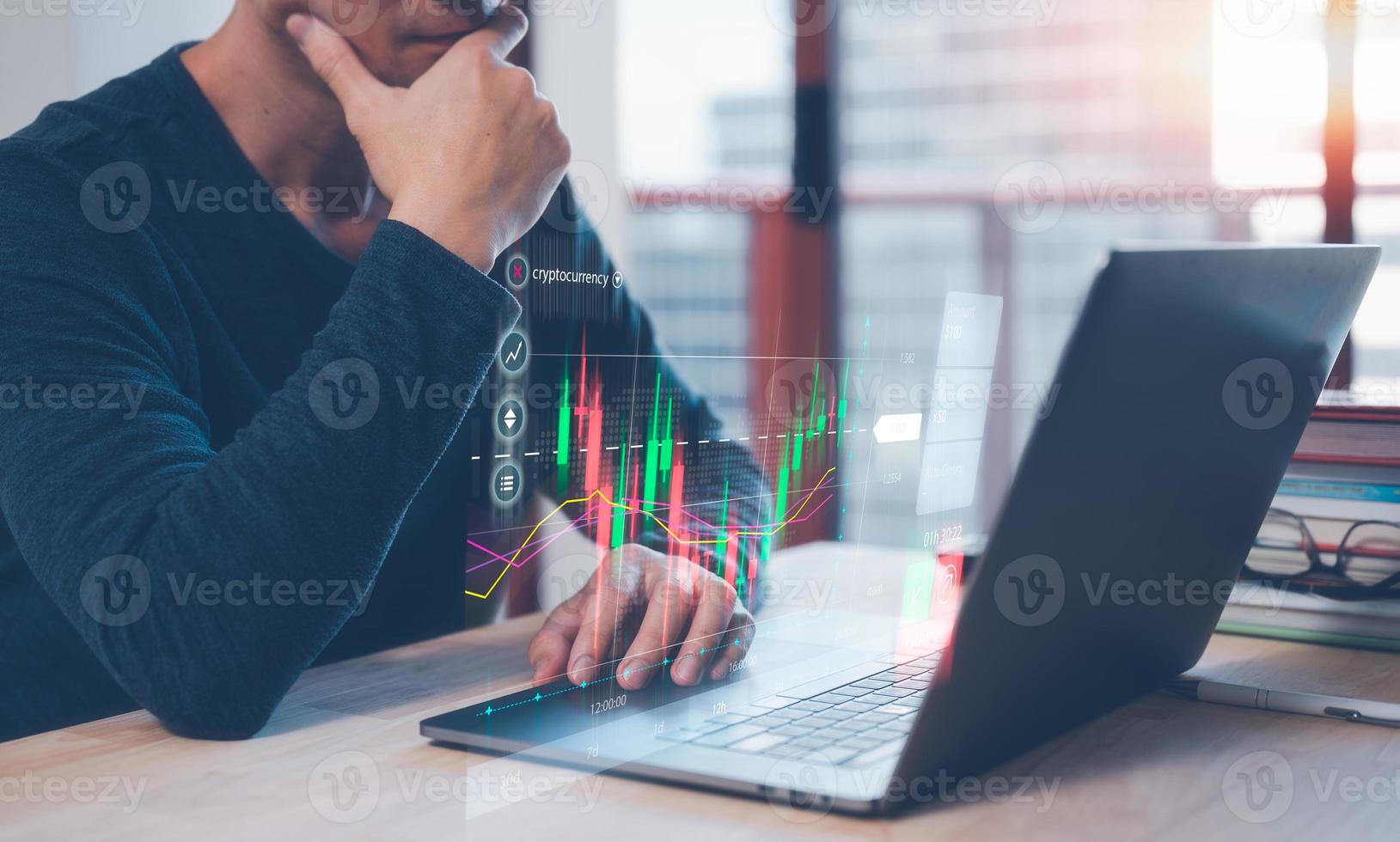 investment and financial concept, stress management work life balance, strategy investment plans, businessman working on computer laptop and virtual trading graph on table in office . photo