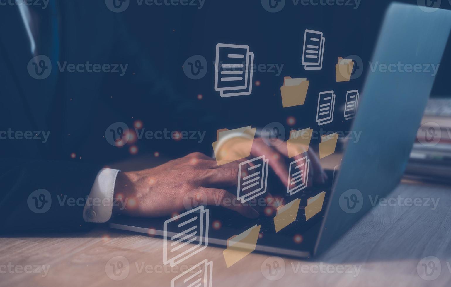 Document Management System ,DMS, businessman working on computer laptop folder document icon, knowledge and documentation in enterprise with ERP. Corporate business technology. photo