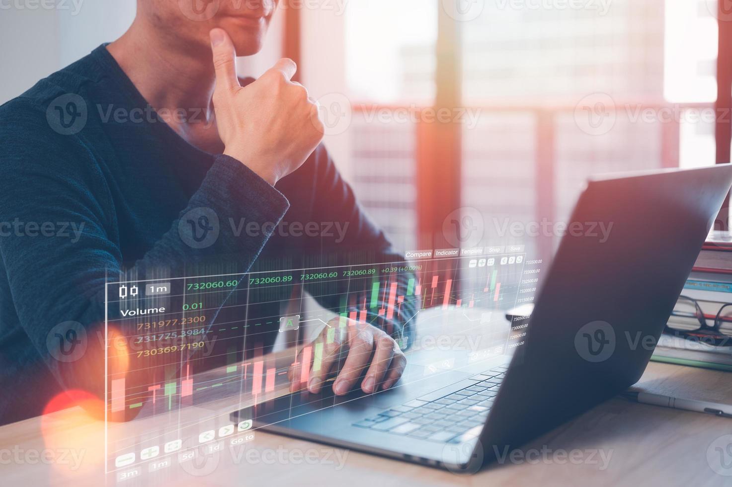 investment and financial concept, stress management work life balance, strategy investment plans, businessman working on computer laptop and virtual trading graph on table in office photo