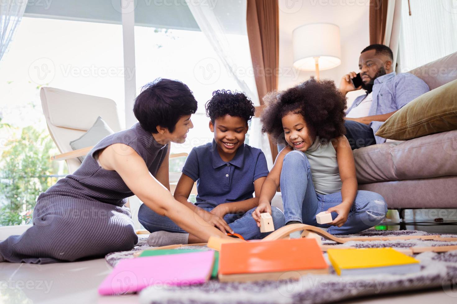 Happy Black Family with Children Playing at Home, Ideal for Parenting and Lifestyle Content photo